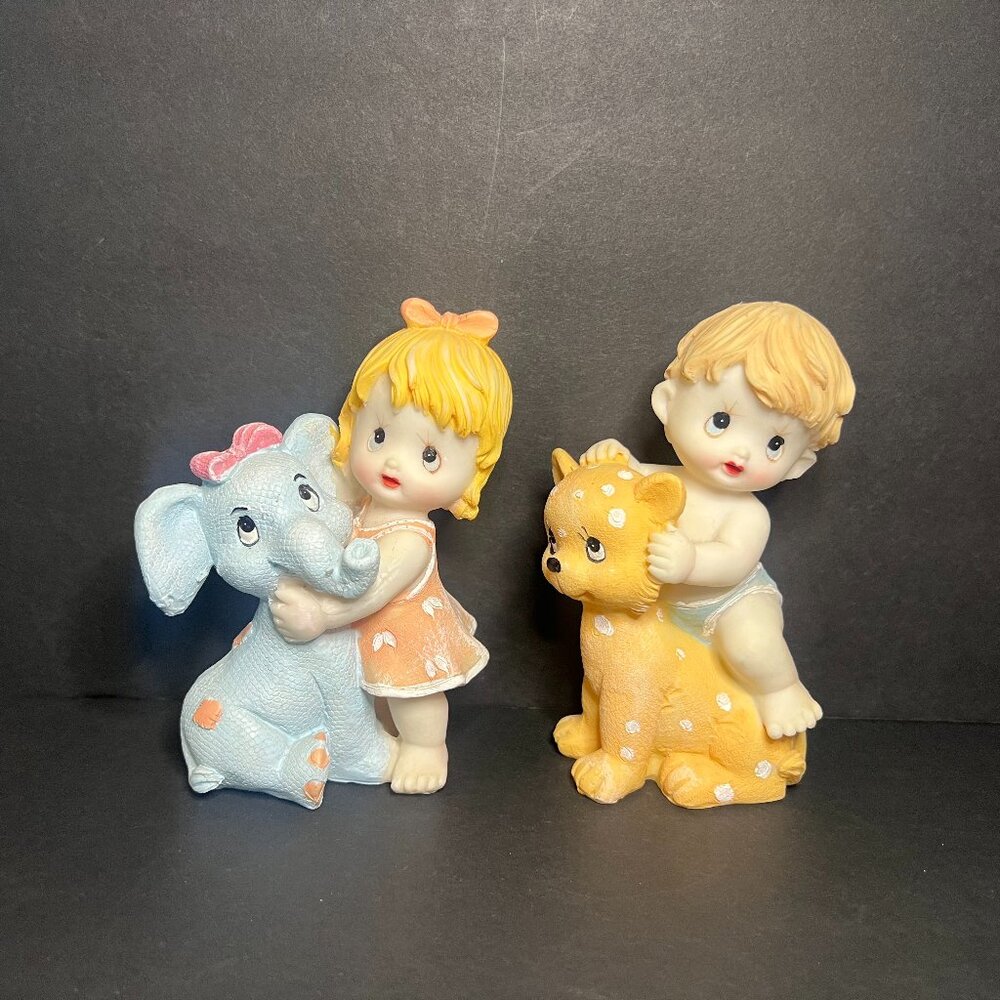 Vintage Rare Set of 2 Resin Girl & Boy Figures holding an Elephant & Lion Toy 5"